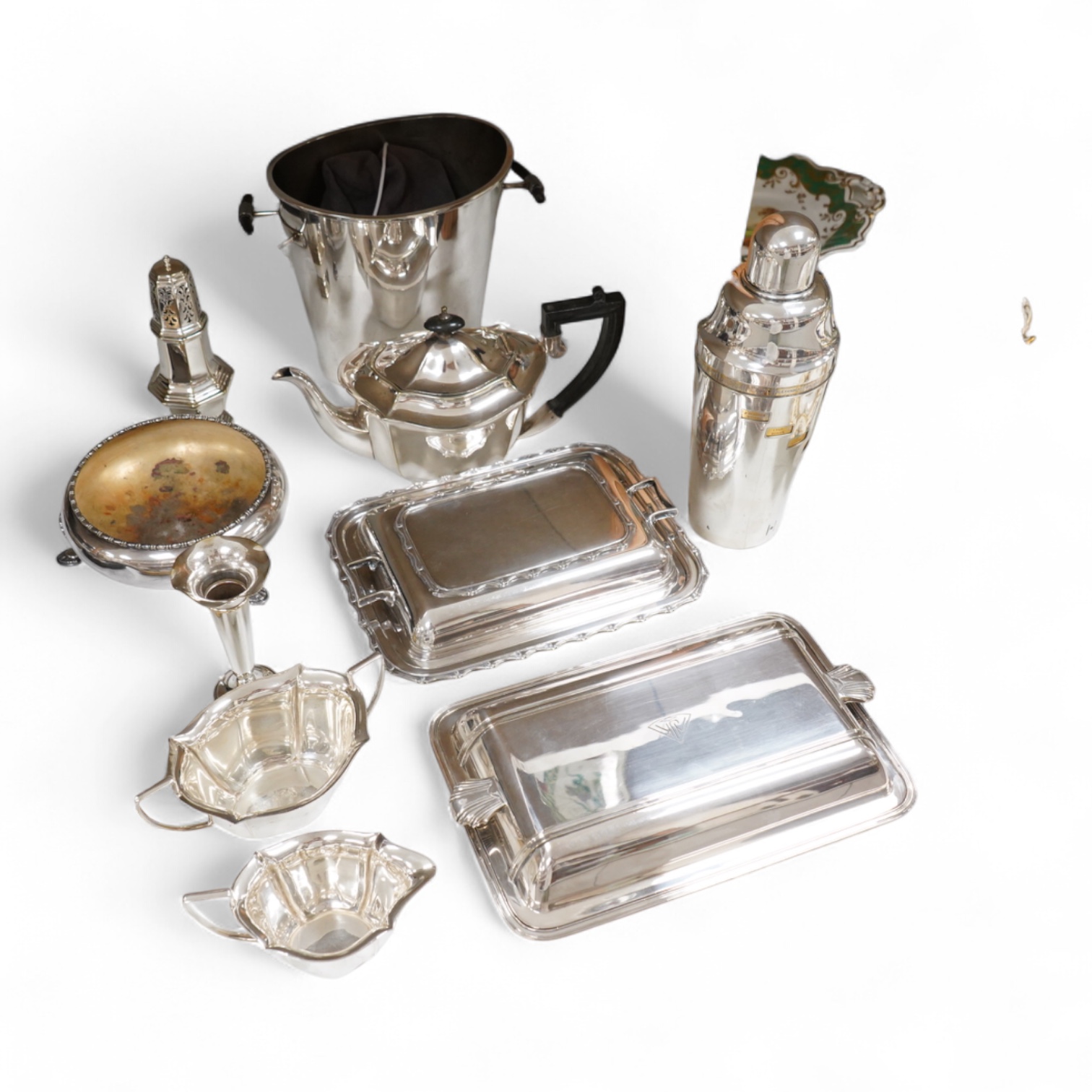 A collection of plated wares to include a vintage cocktail shaker with recipes, wine cooler and two plated entrée dishes including Art deco, largest 29cm wide